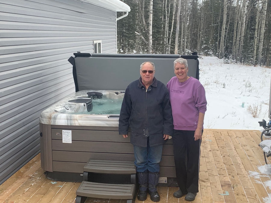 Customers beside a hot tub delivered out of town in winter