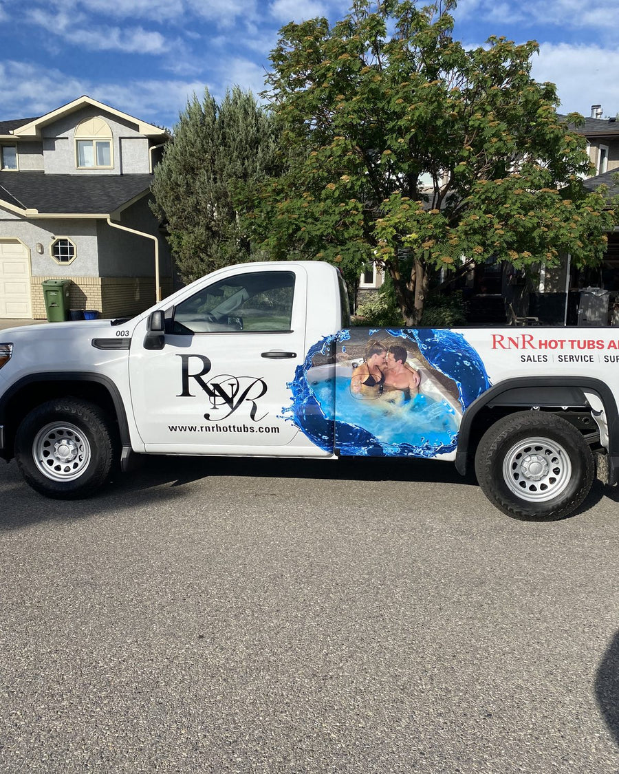 An RnR service truck parked outside a customer’s house