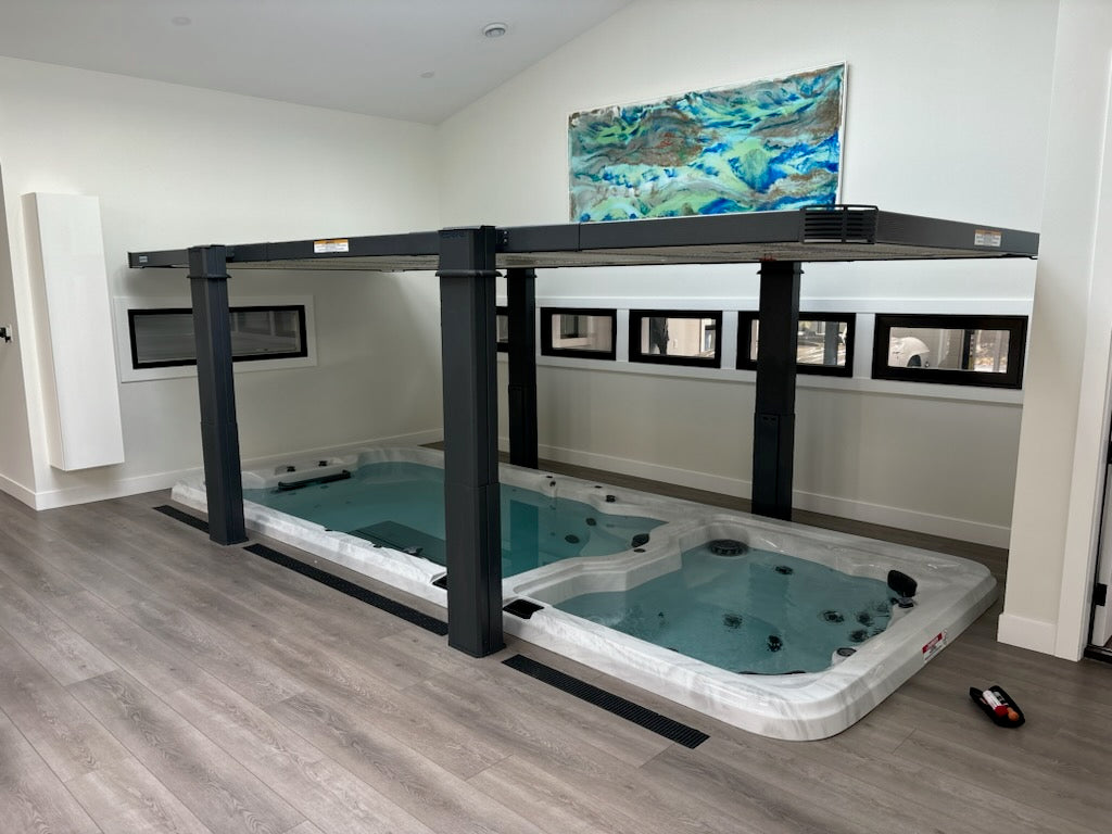 Vita Spa swim spa with a Covana automated cover inside a home installed by RnR Hot Tubs and Spas