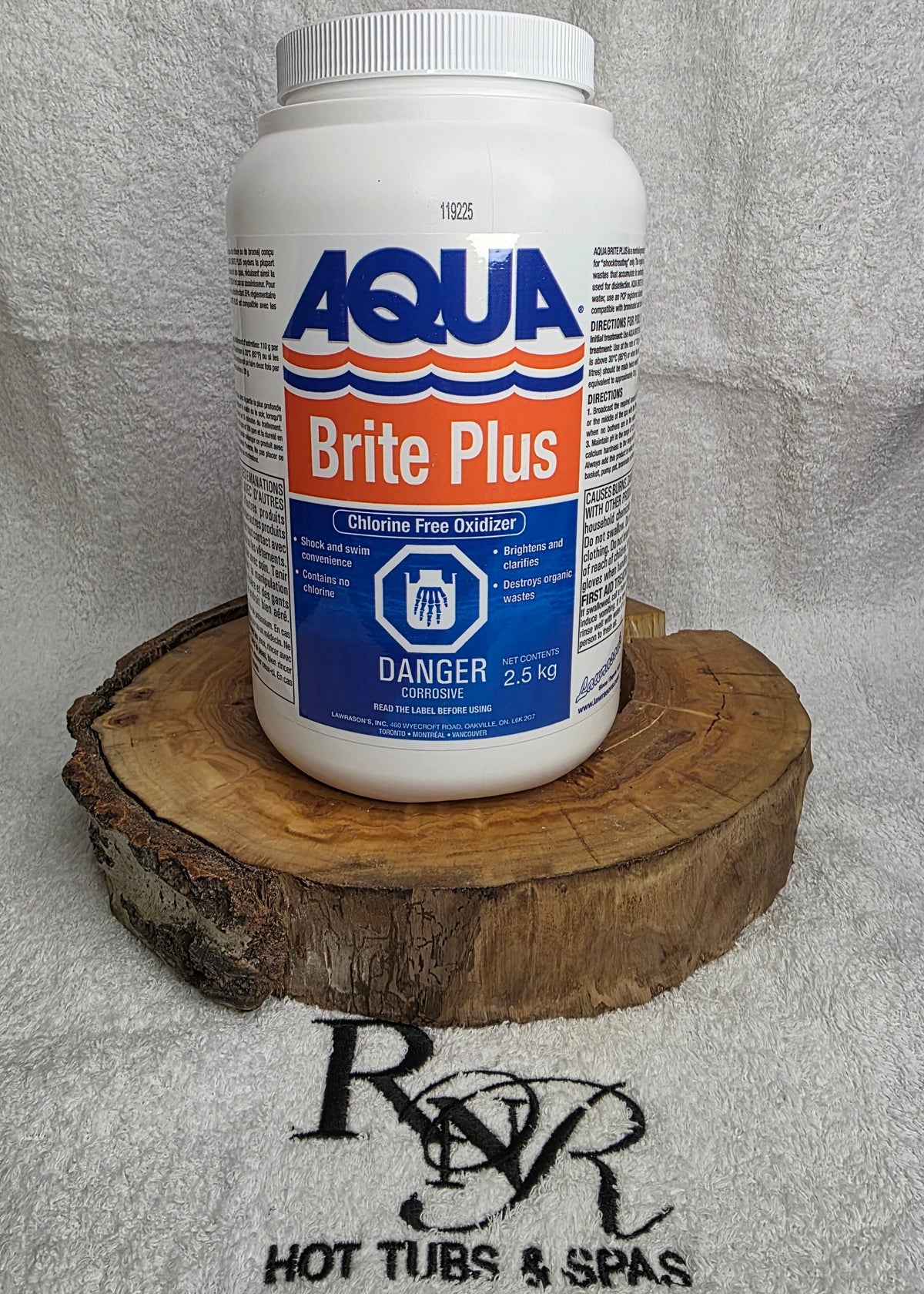 Aqua Brite Plus bottle on a wooden block with a towel and RnR Hot Tubs and Spas logo in the background