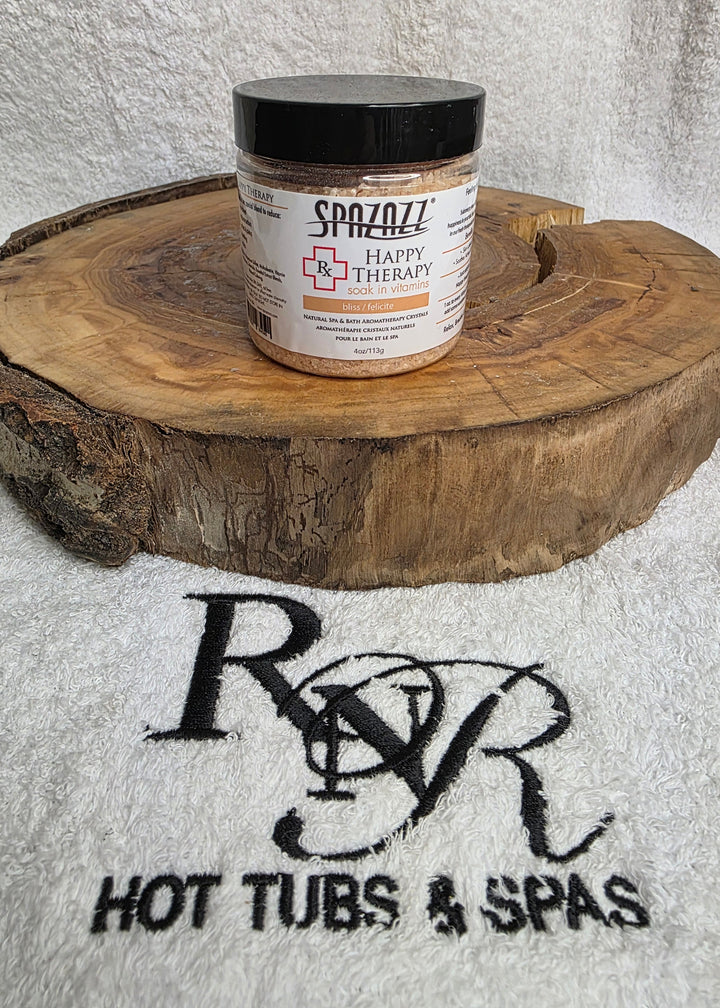 Jar of Spazazz Happy Therapy aromatherapy crystals on a wooden block with RnR Hot Tubs and Spas logo in the background