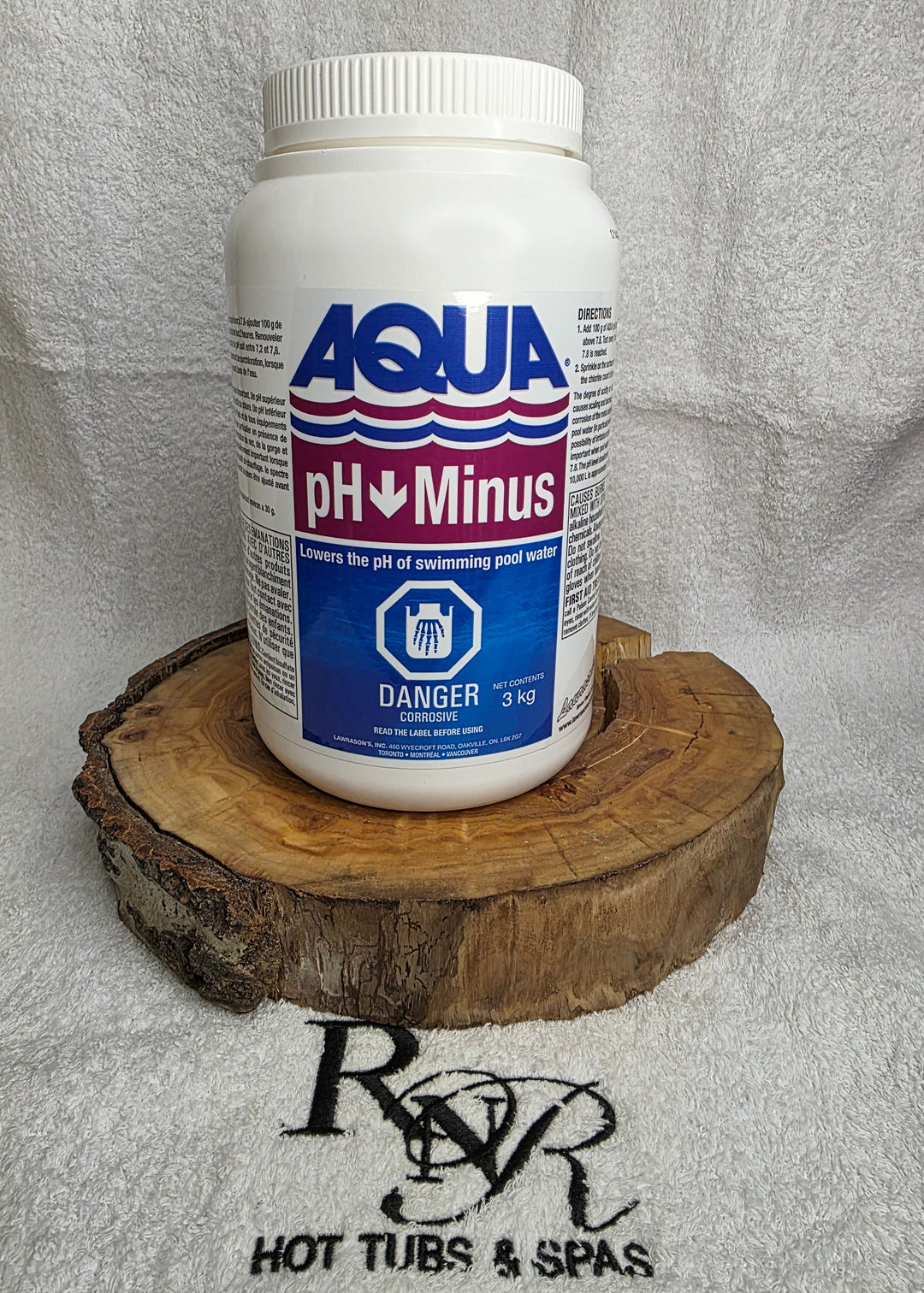 Bottle of Aqua pH Minus on a wooden block with a towel in the background