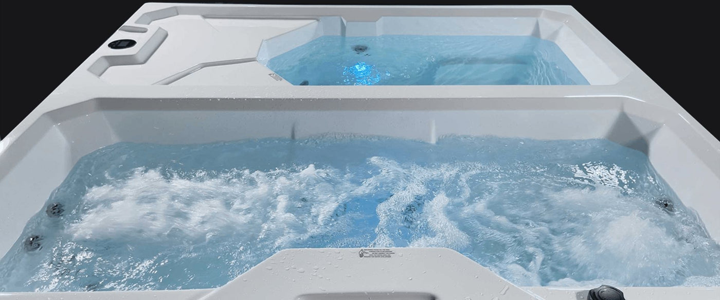 Water running in a dual cold plunge, hot on one side and cold on the other