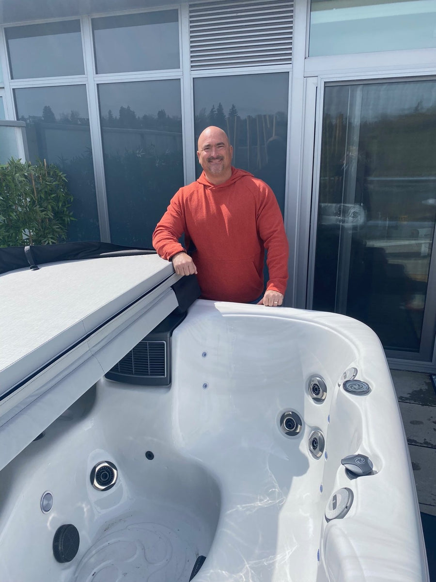 A customer with his spa on delivery day