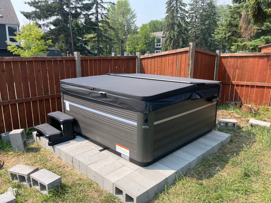 A hot tub installed under a garden gazebo