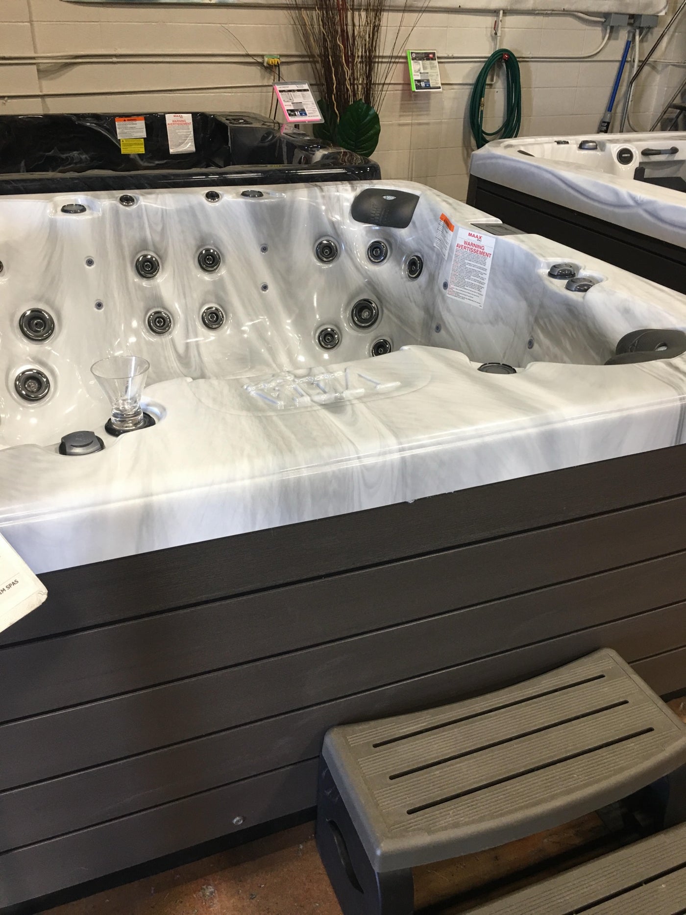Refurbished hot tubs on the floor of the RnR shop in Calgary